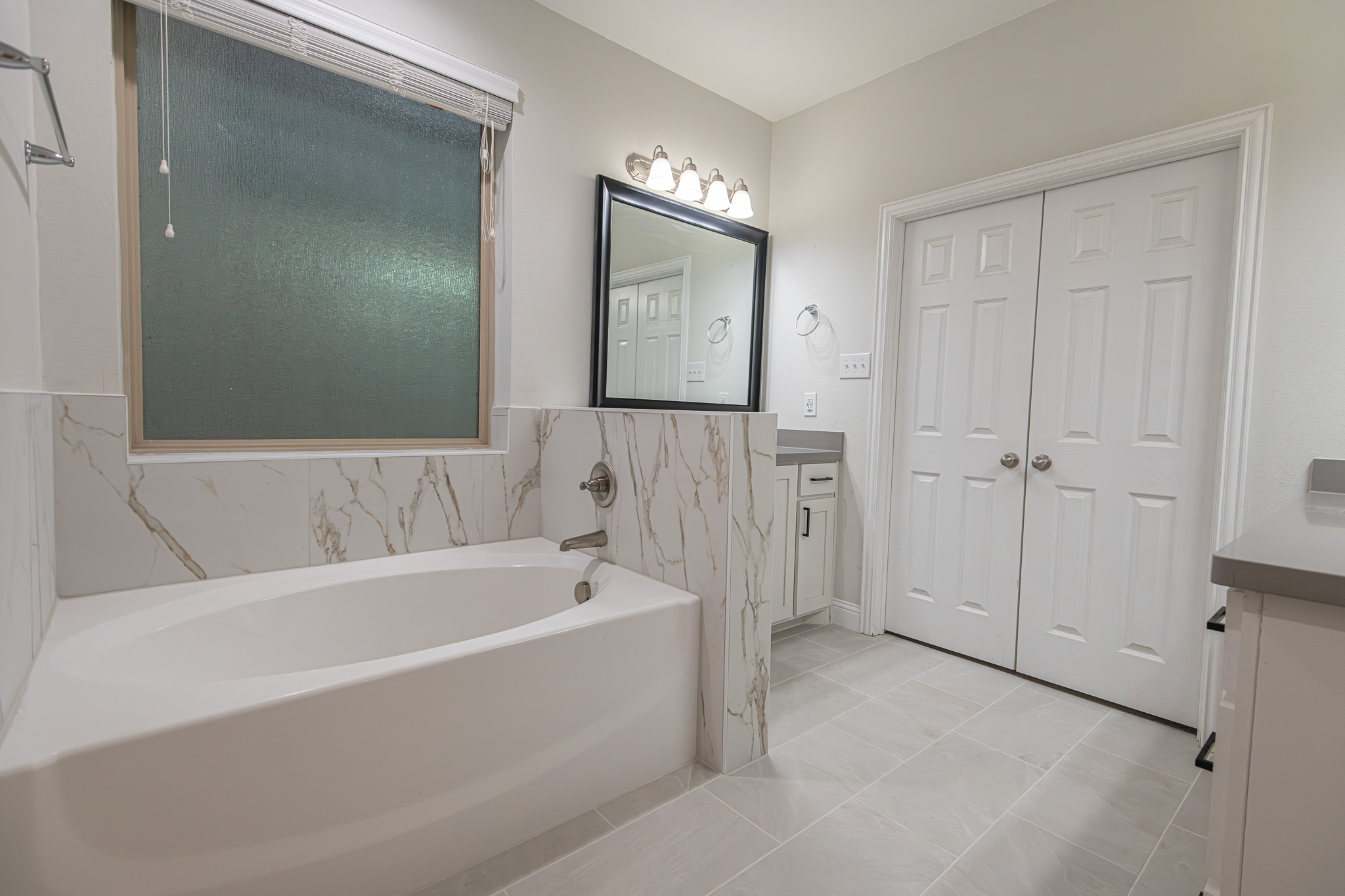 Renovated bathroom by Texas Direct Roofing and Construction